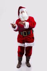 Santa Claus wearing a mask, pointing bottle of hydroalcoholic gel in white background