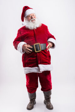 Happy Santa Claus, with hands in his belt in white background