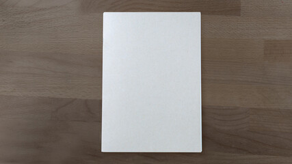 Fototapeta premium Top view of cover notebook on wooden background