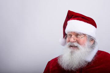 Santa Claus, watching a side  in white background