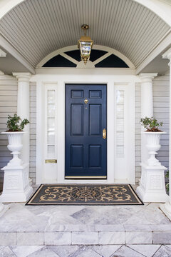 entrance to the house with a dark blue front door © Studio D