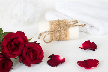 herbal soap spa and terry clothes for health care body skin of lifestyle woman prepare a bath with red rose flower  arrangement flat lay style on background white