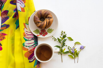 yellow scarf  with healthy drinks ginger tea and dessert bread  of lifestyle woman relax arrangement flat lay style  on background white