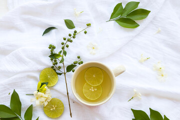 mix honey lemon herbal hot healthy drinks for sore throat with lemon slice and white flower jasmine...