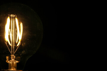 Light bulb tungsten LED on off flicker on black background