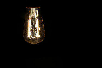 Light bulb tungsten LED on off flicker on black background