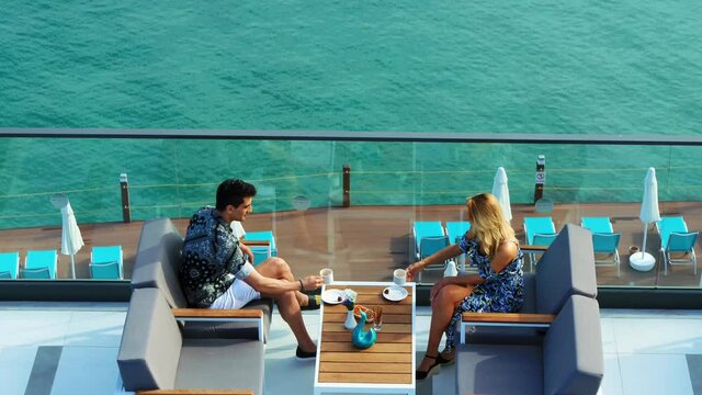 couple is drinking coffee on the terrace of the sea hotel.
