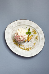 Pavlova dessert course served with feijoa top view