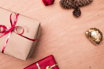 Christmas gifts placed on a wooden table background with christmas decoration