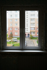 Photo of a finished new double-leaf window in a city apartment
