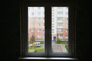 Photo of a finished new double-leaf window in a city apartment