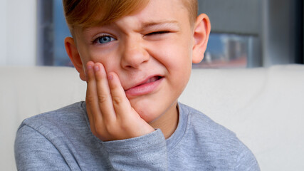 Child toothache. Closeup portrait boy with sensitive tooth ache. Negative human emotion, medicine...
