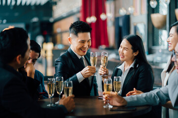 Group Of Asian Friends Enjoying Evening Drinks in bar. Celebration, Party People Christmas and Happy new year concept. Asian business people in party.