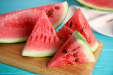 Yummy watermelon slices on wooden board, closeup