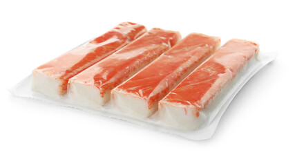 Delicious crab sticks in plastic packaging isolated on white