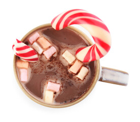 Cup of tasty cocoa with marshmallows and Christmas candy cane isolated on white, top view
