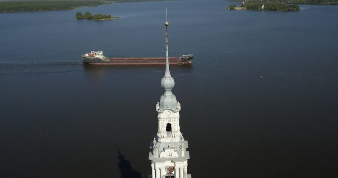 4K high quality aerial video footage of partly submerged Nikolskiy/St. Nicholas Сathedral bell tower off the shore Kalyazin town on great Volga River, Golden Ring route 200 km from Moscow, Russia
