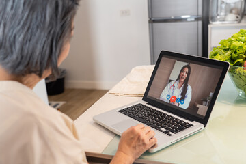 Asian female patient consult doctor for health problem on video call