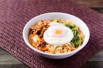 Korean food, Spicy noodles soup with kimchi and egg, Top view