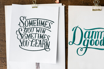 Hand lettering of motivation quote on sketch sheets