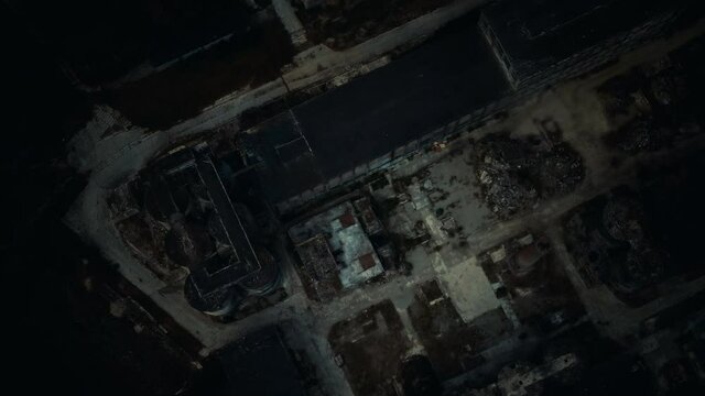 Abandoned brick and paving slabs factory at night