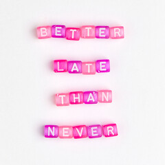 BETTER LATE THAN NEVER beads word typography
