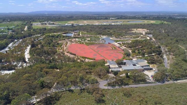 Forward flight over bush towards Royal Botanic Gardens in Cranbourne, Australia