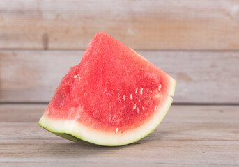 There is a sliced watermelon on the table
