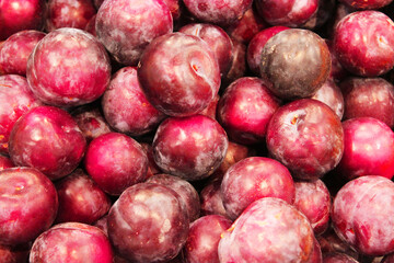 View from above. background Macro photo food fruit plum. Fresh plums texture background. Photo of fruit products plum. Purple fruit background with ripe delicious sweet plums from the garden