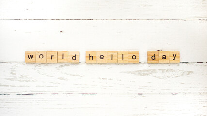 World Hello Day.words from wooden cubes with letters photo