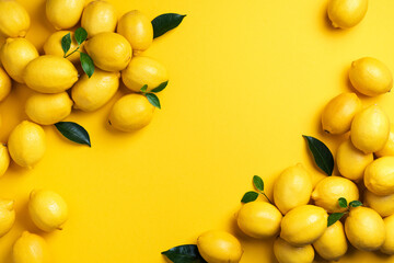 Lemons frame on yellow background. Immune system booster. Copy space. Top view. Flat lay. Citrus fruits. Vitamins for health. Liposomal vitamin C. Lemon for vegan, vegetarian alkaline diet