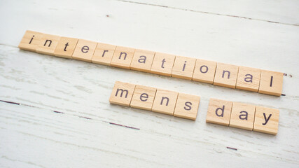 International Men's Day.words from wooden cubes with letters photo