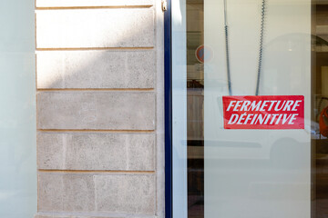 store panel on closed boutique windows in french fermeture definitive means final closure