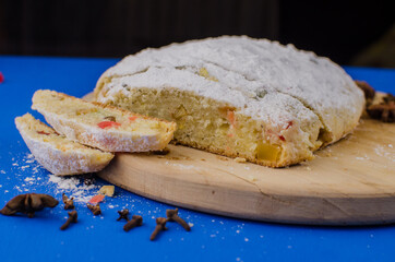 Christmas cake with fruits on a blue background