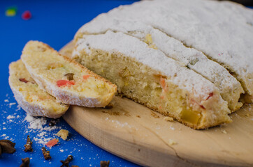Christmas cake with fruits on a blue background