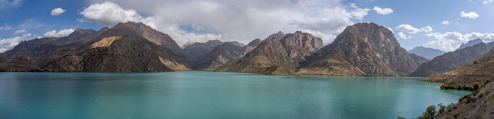 Scenic panoramic view of colorful lake Iskanderkul in the Fann mountains, Sughd, Tajikistan