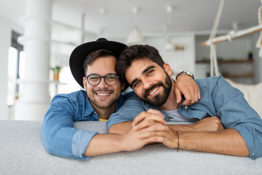 Happy Gay Couple Embraced, Joking And Having Fun In An Intimate Hug