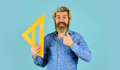 Measurement tool. Teacher stem. School education. Interesting riddle. Find solution. Free education. Teaching geometry. Bearded man use ruler. Education concept. School classes. Studying with fun