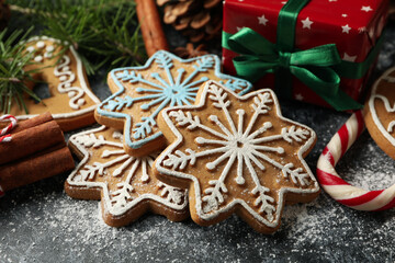 Concept of Christmas food with tasty cookie on black smokey background