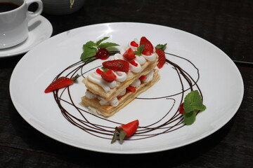 Strawberry Mille Feuille cake in white plate.