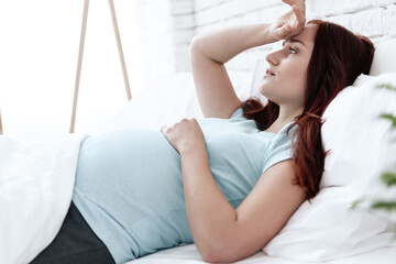 A pregnant woman has a stomach ache.