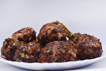 indian chinese, Gobi Manchurian dry - Popular street food of India made of cauliflower and vegetables