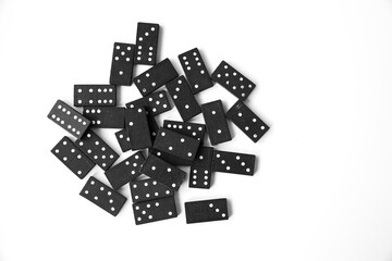 Black dominoes standing on isolated white background