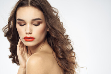 Naklejka premium Beautiful woman with drawn swords bright makeup glamor close-up light background