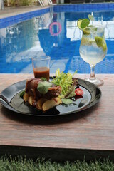 delicious food and drink with pool view