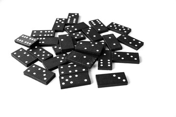 Black dominoes standing on isolated white background
