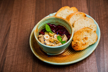 Chicken paste or pate with stewed beetroot and nuts, served with grilled bread