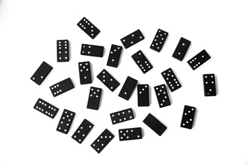 Black dominoes standing on isolated white background