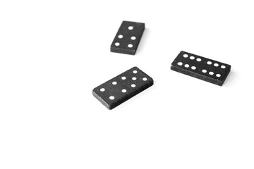 Black dominoes standing on isolated white background