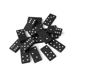Black dominoes standing on isolated white background